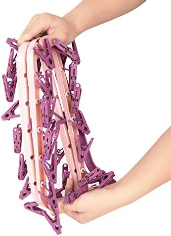 Pink plastic hanger with 32 clips — photo 4