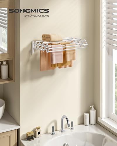Wall mounted accordion rack with nine staggered rods — photo 5
